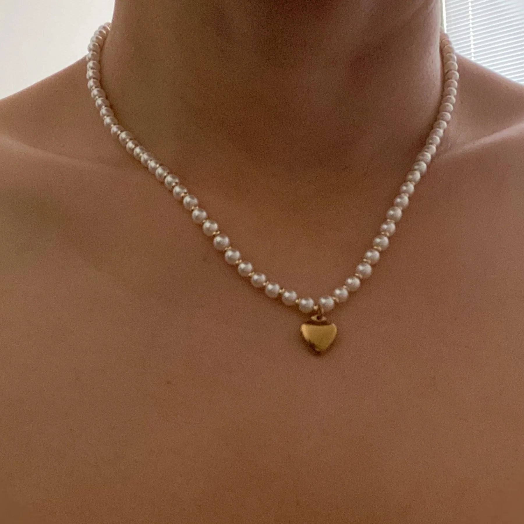 "Glamorous Heart Necklace with Pearl and Gold Baubles"